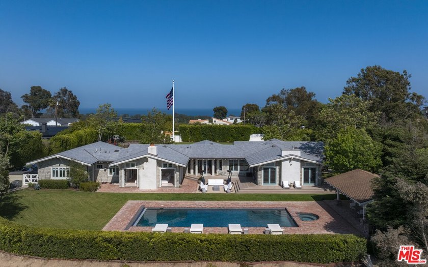 Set behind gates along coveted Dume Road, this private Point - Beach Home for sale in Malibu, California on Beachhouse.com