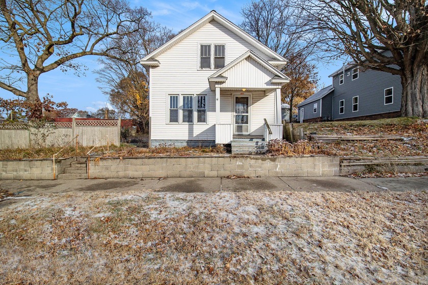 Just a block from Pere Marquette Lake, including views of the - Beach Home for sale in Ludington, Michigan on Beachhouse.com