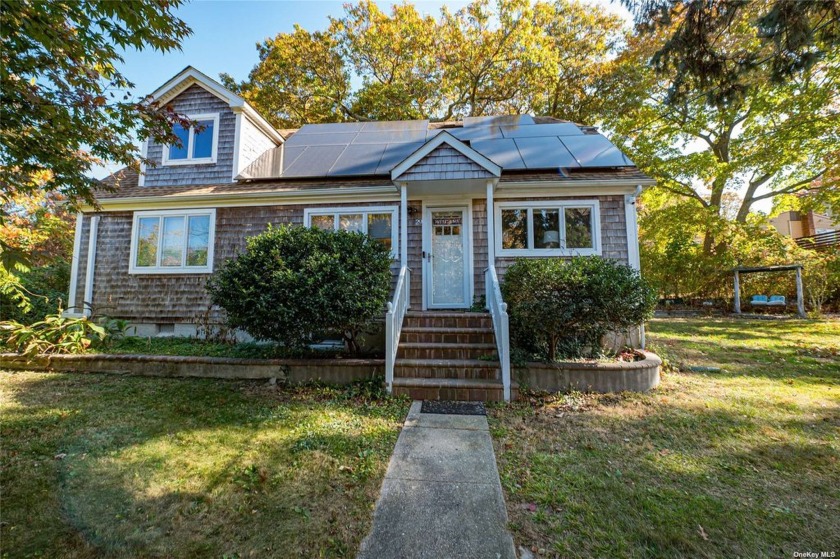 Welcome to this bright and airy 2-bedroom, 2-bathroom retreat - Beach Home for sale in Rocky Point, New York on Beachhouse.com