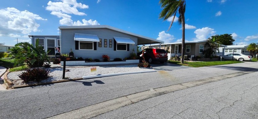 Nestled in a serene setting by the pond, this delightful 2 bed 2 - Beach Home for sale in Sarasota, Florida on Beachhouse.com