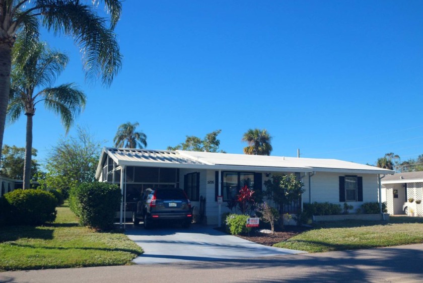 An adorable warm and welcoming 2-bedroom 2-bath manufactured - Beach Home for sale in Sarasota, Florida on Beachhouse.com