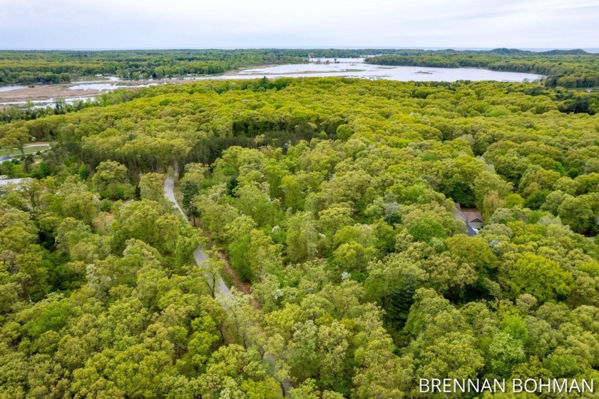 Privacy awaits on this beautiful 1.5 acre wooded lot in the - Beach Lot for sale in Saugatuck, Michigan on Beachhouse.com