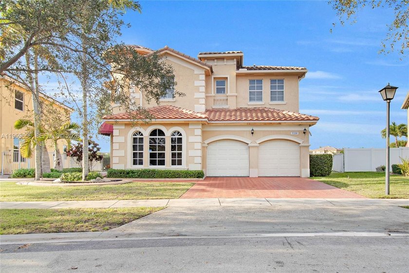 Experience this fantastic single-family home in a secure gated - Beach Home for sale in Miramar, Florida on Beachhouse.com