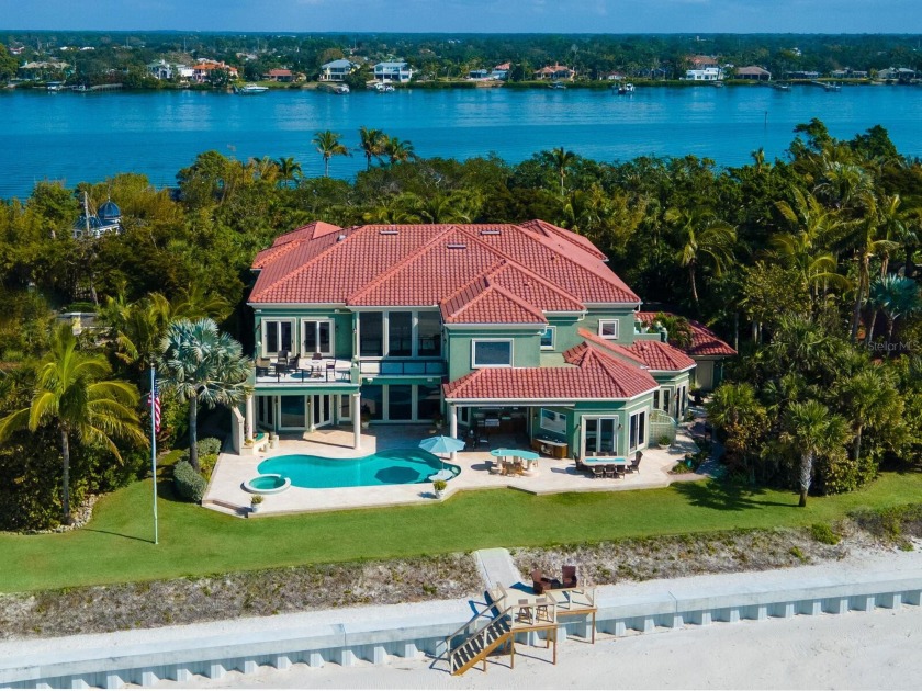 Nestled on 149 feet of private sandy walking beach, this - Beach Home for sale in Nokomis, Florida on Beachhouse.com