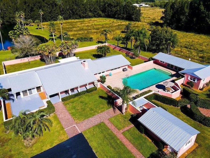 Welcome home to a rare Old Florida private estate situated on 4 - Beach Home for sale in Fort Pierce, Florida on Beachhouse.com
