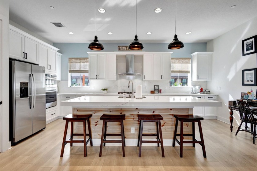 Enjoy breathtaking lake views from this exceptional 3-bedroom + - Beach Townhome/Townhouse for sale in Palm Beach Gardens, Florida on Beachhouse.com
