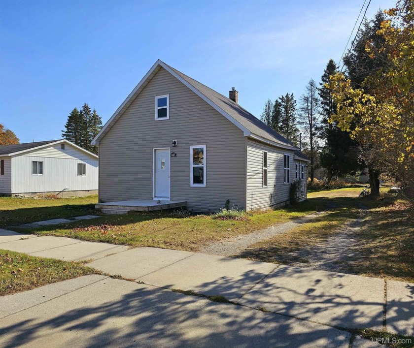 This charming, remodeled ranch-style home is ready to welcome - Beach Home for sale in Manistique, Michigan on Beachhouse.com