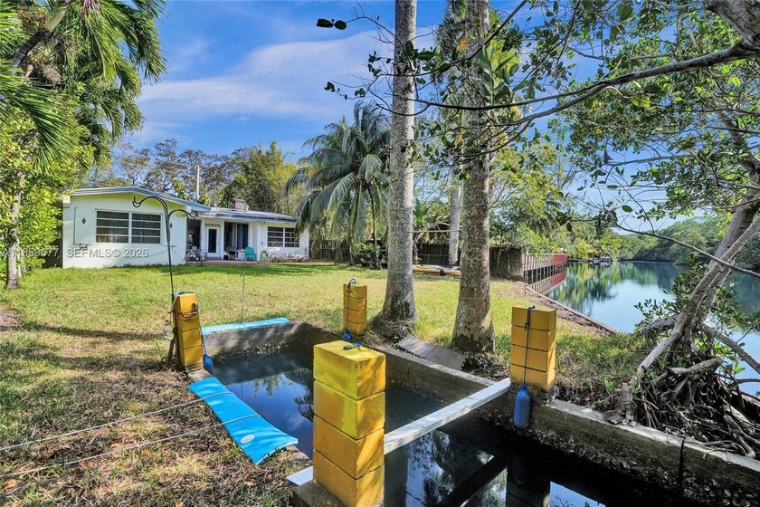 An original and charming 3BD/2BA RIVERFRONT residence offering - Beach Home for sale in Miami, Florida on Beachhouse.com