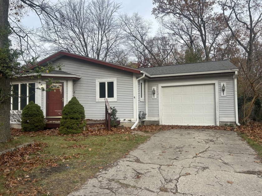 This beautiful two-bedroom home is located within 5 minutes of - Beach Home for sale in Norton Shores, Michigan on Beachhouse.com