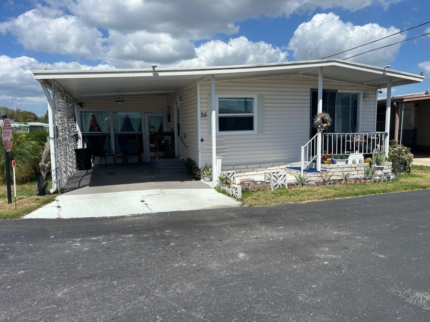 Partially Furnished Double Wide - is situated on a corner lot - Beach Home for sale in St. Petersburg, Florida on Beachhouse.com