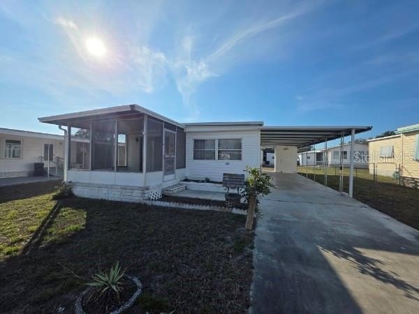 Your Slice of Paradise Awaits! Double Wide on OWNED LAND in a - Beach Home for sale in Holiday, Florida on Beachhouse.com