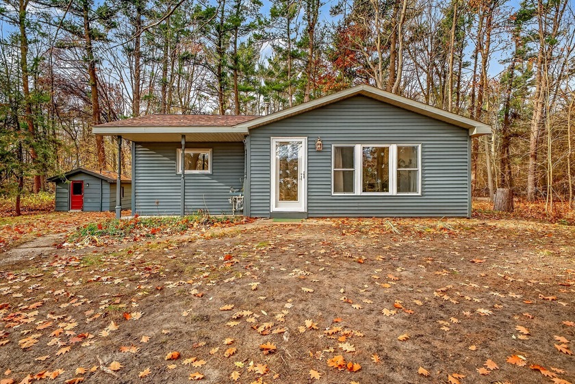 Welcome to a beautifully updated home tucked away on a private 1 - Beach Home for sale in Montague, Michigan on Beachhouse.com