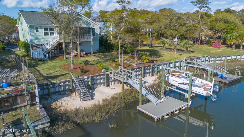 WATERFRONT with a dock and boat lift on Oak Island. The Little - Beach Home for sale in Oak Island, North Carolina on Beachhouse.com