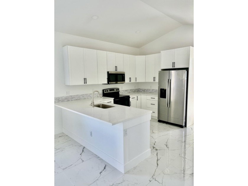 Discover this charming 3-bedroom, 2-bathroom home, built in 2023 - Beach Home for sale in Lantana, Florida on Beachhouse.com