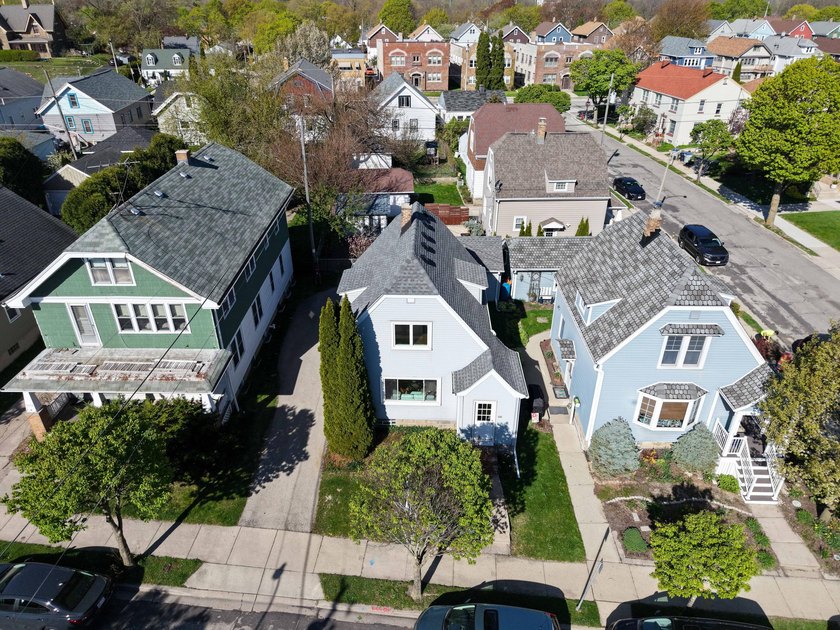Welcome home to Swain Court! This charming home is tucked into - Beach Home for sale in Milwaukee, Wisconsin on Beachhouse.com
