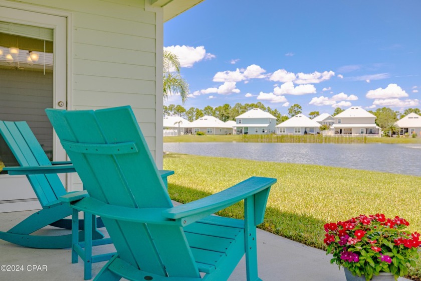 Discover the charm of this waterfront home, nestled by a serene - Beach Home for sale in Panama City Beach, Florida on Beachhouse.com
