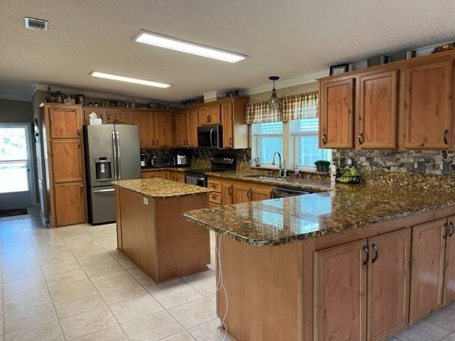 This beautifully updated triple-wide home offers a spacious 1 - Beach Home for sale in Punta Gorda, Florida on Beachhouse.com