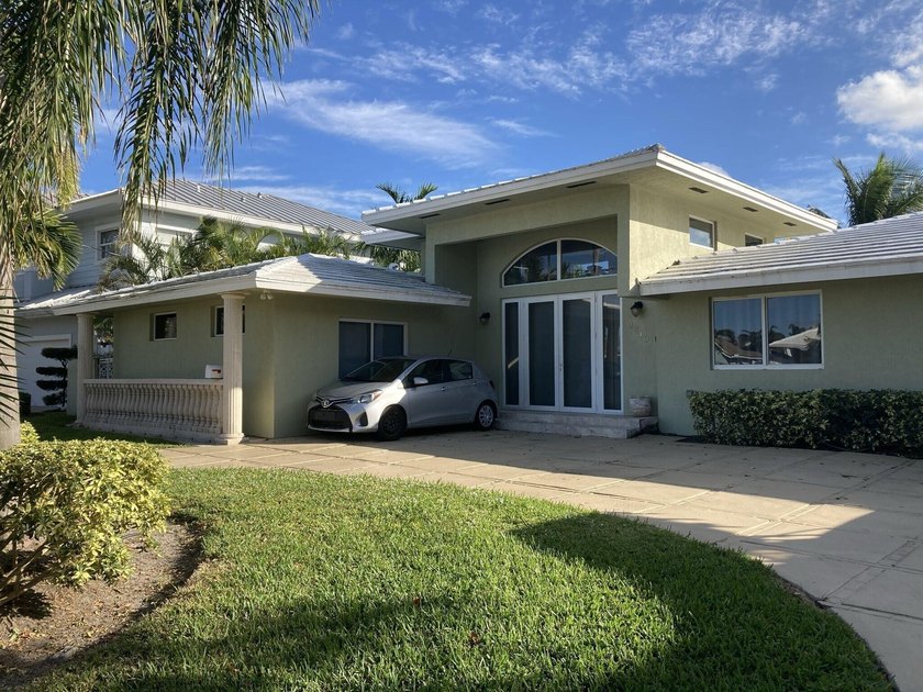 This wonderful single story waterfront home with 80 feet of - Beach Home for sale in Pompano Beach, Florida on Beachhouse.com