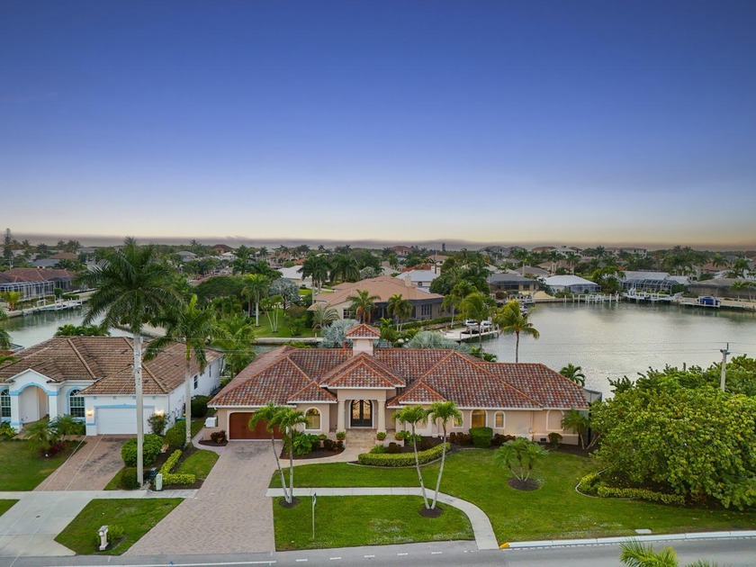 Set on a rare, oversized tip lot, this Marco Island residence - Beach Home for sale in Marco Island, Florida on Beachhouse.com