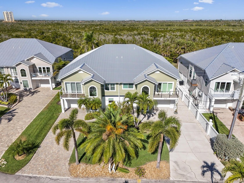Experience a rare dual-waterfront estate offering protected - Beach Home for sale in Fort Myers Beach, Florida on Beachhouse.com