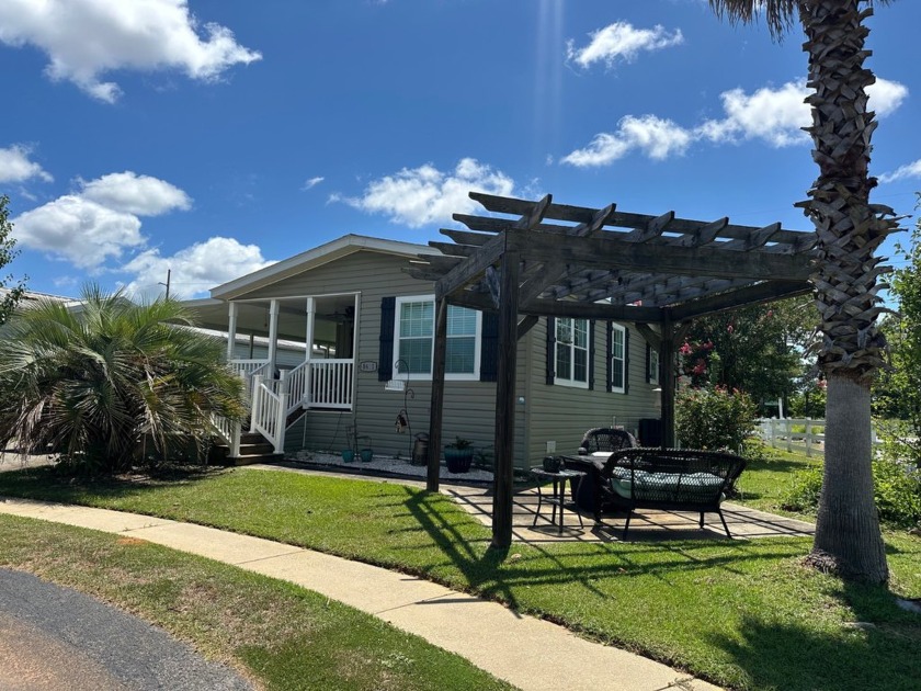 Located in the Foley Grove, a charming land-leased 55+ - Beach Home for sale in Foley, Alabama on Beachhouse.com