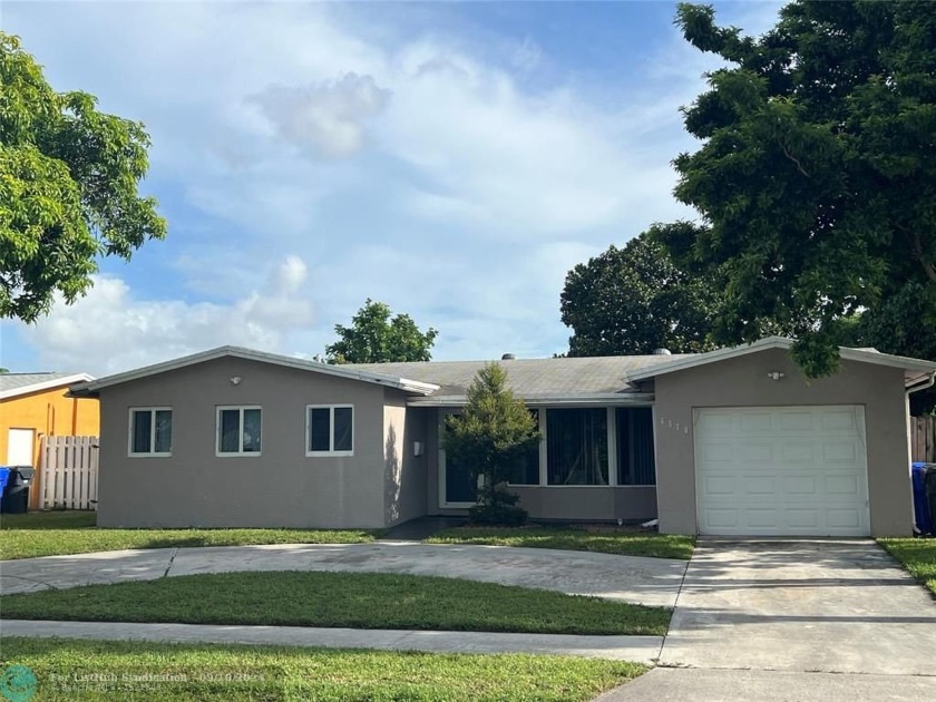 Envision a cozy one-story home that boasts three well-sized - Beach Home for sale in North Lauderdale, Florida on Beachhouse.com