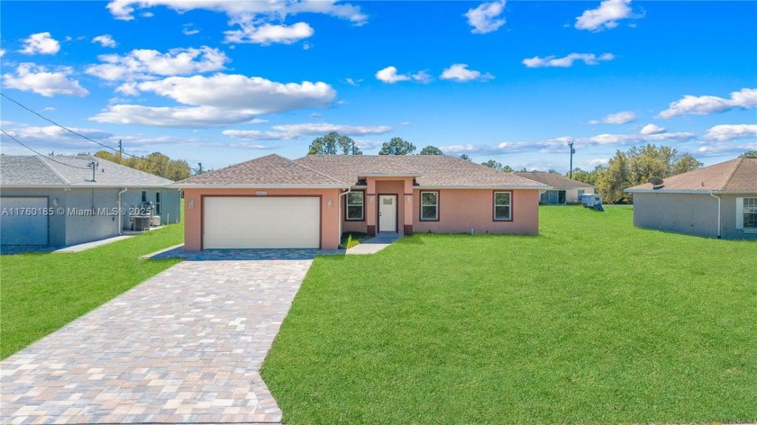 BRAND NEW CONSTRUCTED HOUSE NEVER LIVED IN !!!! THE PROPERTY - Beach Home for sale in Lehigh Acres, Florida on Beachhouse.com