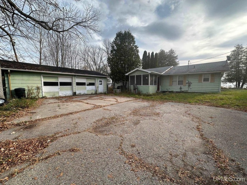 Discover 200 feet of stunning bay frontage with this 3 BR 1.5 BA - Beach Home for sale in Menominee, Michigan on Beachhouse.com