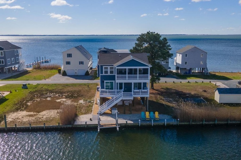 Experience waterfront living in Captains Cove, featuring a - Beach Home for sale in Greenbackville, Virginia on Beachhouse.com