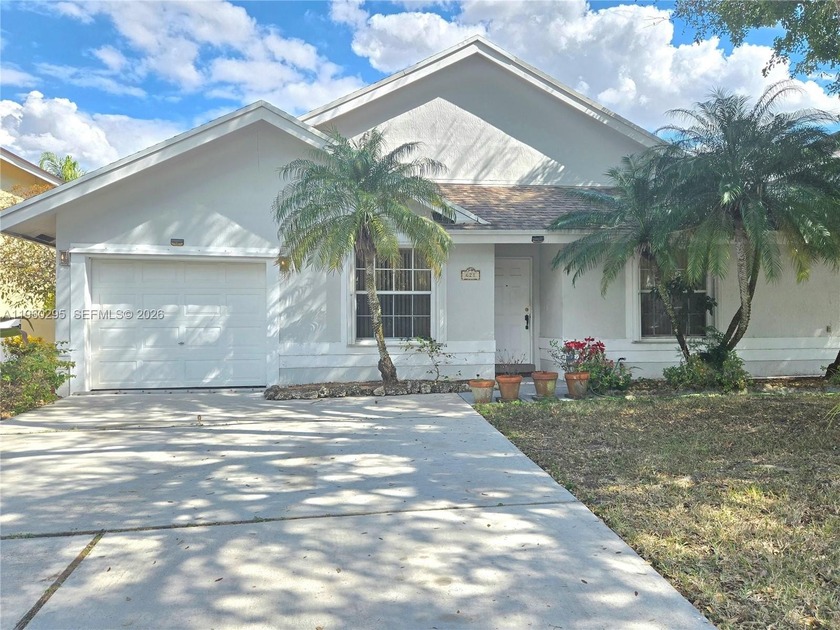 Welcome to this 4-bedroom, 2-bath single-family Lake home - Beach Home for sale in Pembroke Pines, Florida on Beachhouse.com
