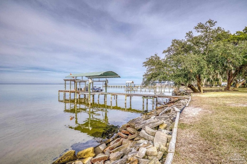 Water front living at its best! This lovely home sits on - Beach Home for sale in Gulf Breeze, Florida on Beachhouse.com