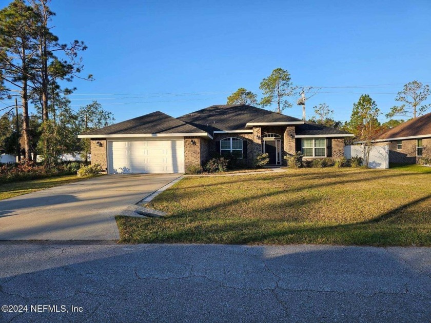 This LIKE NEW full brick home features 4 bedrooms, 3 full baths - Beach Home for sale in Palm Coast, Florida on Beachhouse.com