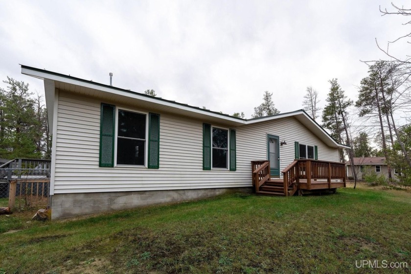 Welcome to 850 Lakewood Lane, a house nestled in the serene - Beach Home for sale in Marquette, Michigan on Beachhouse.com