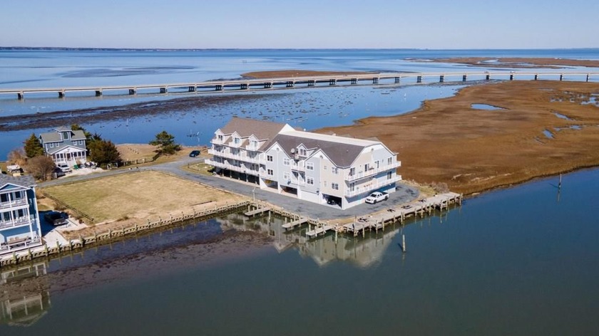 Discover waterfront living in this charming 2 bed, 1.5 bath - Beach Townhome/Townhouse for sale in Chincoteague Island, Virginia on Beachhouse.com