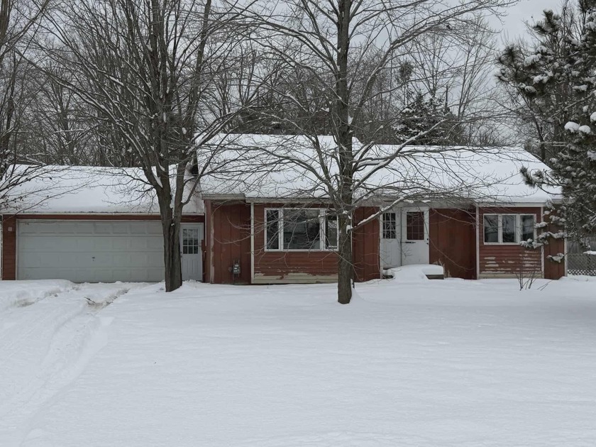 This includes 3 bedrooms and 1.5 baths. The home is located on a - Beach Home for sale in Alanson, Michigan on Beachhouse.com