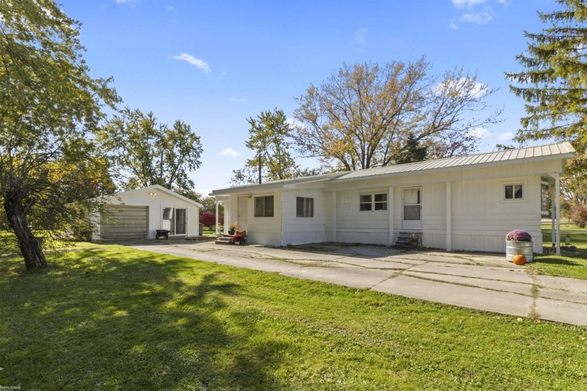 Come see this wonderfully updated lake side home with a - Beach Home for sale in Lexington, Michigan on Beachhouse.com