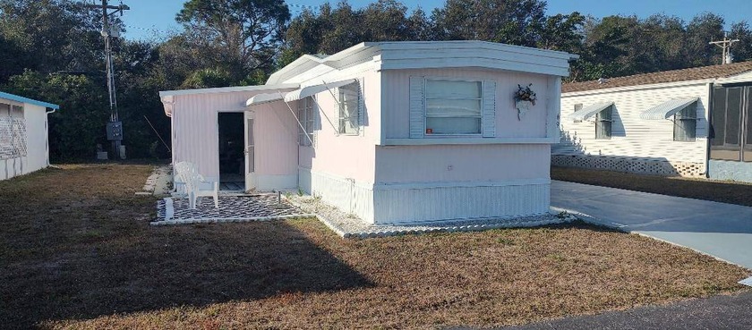 THIS ADORABLE BUT VERY OPEN AND SPACIOUS HOME IS GORGEOUS - Beach Home for sale in North Fort Myers, Florida on Beachhouse.com