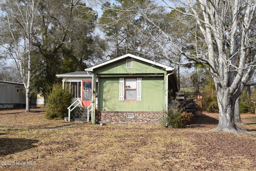 This well-cared for home, located on a quiet street, is just - Beach Home for sale in Sunset Beach, North Carolina on Beachhouse.com