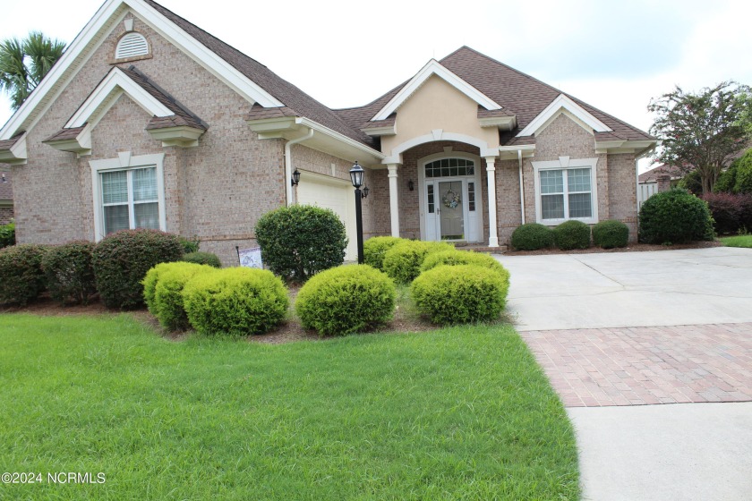 : BEAUTIFUL 3 BR, 2 BA, 2 CAR GARAGE BRICK HOME IN THE MUCH - Beach Home for sale in Ocean Isle Beach, North Carolina on Beachhouse.com