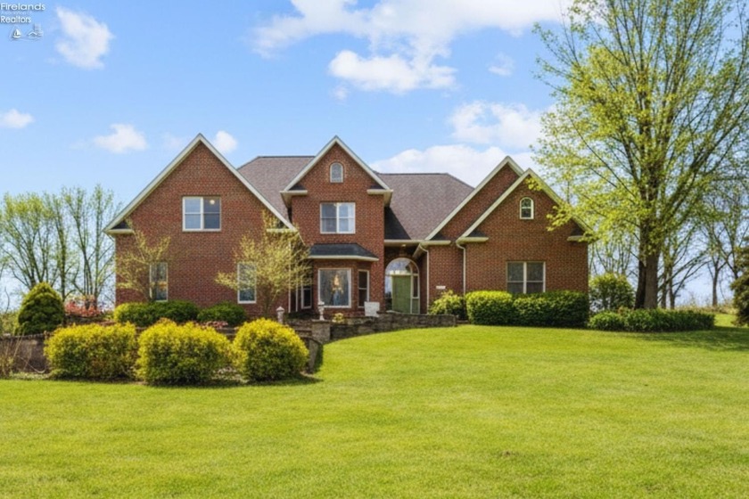 Set on a breathtaking 2.44-acre estate, this all-brick residence - Beach Home for sale in Huron, Ohio on Beachhouse.com