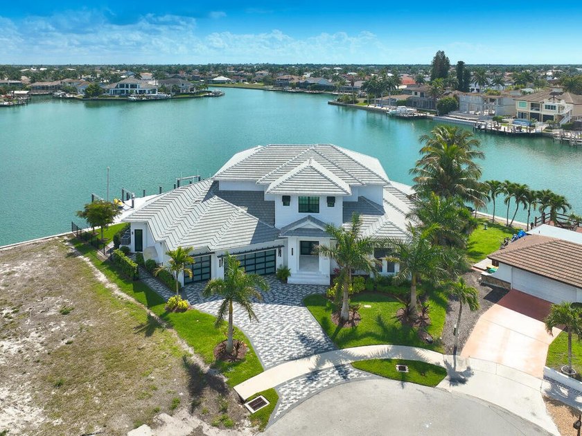 Experience the pinnacle of waterfront living at 999 Spruce Court - Beach Home for sale in Marco Island, Florida on Beachhouse.com