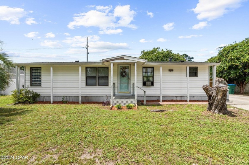 Introducing a charming three-bedroom, two-bathroom home located - Beach Home for sale in Panama City Beach, Florida on Beachhouse.com