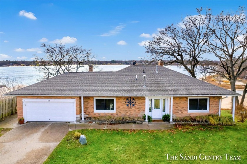 Income-Generating Waterfront Home on Wolf Lake - A Year-Round - Beach Home for sale in Muskegon, Michigan on Beachhouse.com