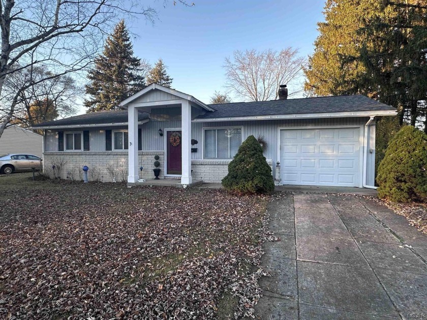 Charming 3-Bedroom, 2-Bath Ranch Home Overlooking AuSable River - Beach Home for sale in Oscoda, Michigan on Beachhouse.com