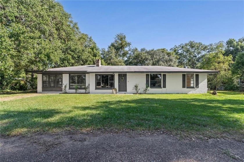 Discover this charming waterfront property situated on - Beach Home for sale in Mobile, Alabama on Beachhouse.com