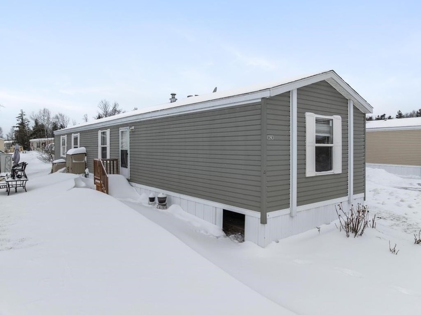 Located in the Conway Commons Community, this 2016 home offers - Beach Home for sale in Alanson, Michigan on Beachhouse.com