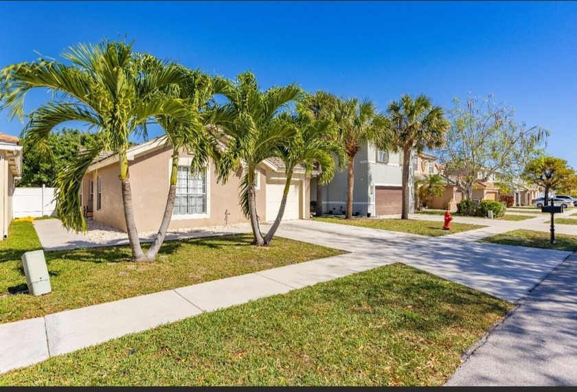 Welcome to this charming 3-bedroom, 2-bathroom home with a 1-car - Beach Home for sale in Lake Worth, Florida on Beachhouse.com