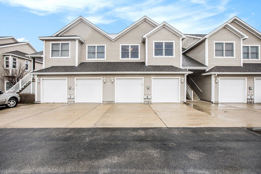 Experience the best of waterfront living in this Manistee Lake - Beach Condo for sale in Manistee, Michigan on Beachhouse.com