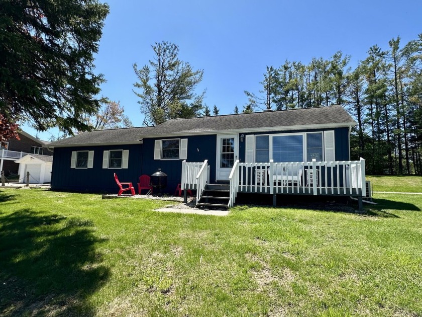 Charming year-round cottage on the Cheboygan River, part of the - Beach Home for sale in Cheboygan, Michigan on Beachhouse.com