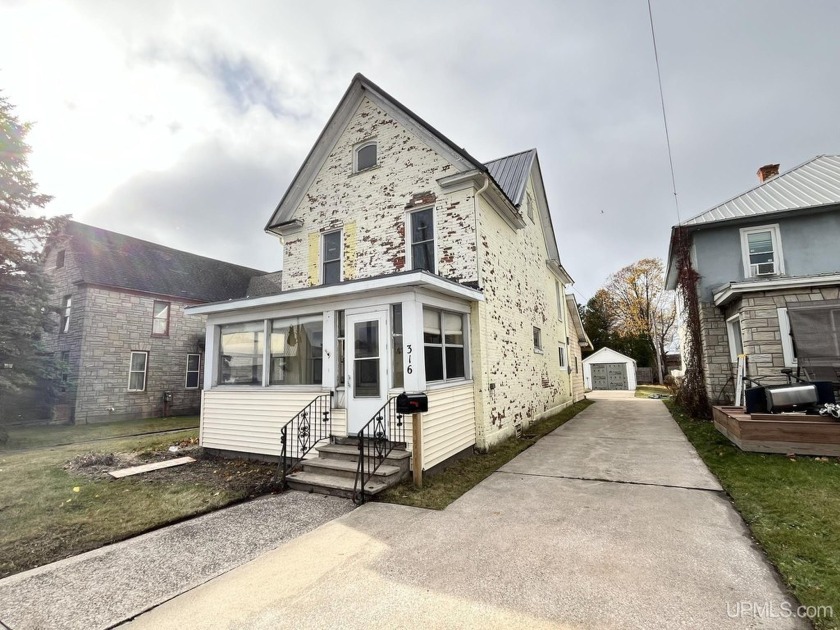 Welcome home to this charming, updated 4-bedroom, 1.75-bathroom - Beach Home for sale in Manistique, Michigan on Beachhouse.com